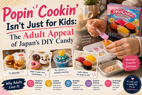 Adult hands making Popin' Cookin' DIY candy — piping pink 'ice cream' from the kit tray, surrounded by finished mini candy sushi, a burger, decorated donuts and a cup dessert, beside a Popin' Cookin' box and coffee.